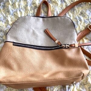 Back back style purse with golden accent zippers